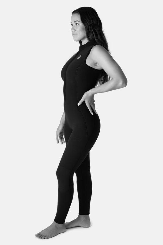 Jonesea Black High-Neck Betty Jane Springsuit – Side view of handmade women's neoprene wetsuit in Black, front zip, hand on hip, white background